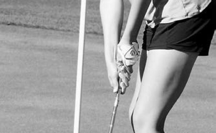 Lily Zimmer sinks a putt and shot a 104 for the day at the Grafton Invitational Meet. Photo by Larry Stokke.