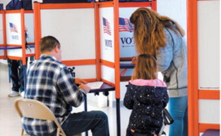 Voters cast ballots at the Hillside Aquatic Complex in Bismarck on Election Day, Nov. 5, 2024. Michael Achterling/North Dakota Monitor