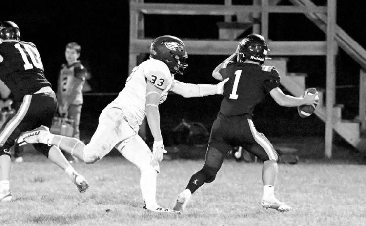 Kade Schafer sacking the Charger’s quarterback. Photo by Ashley Schafer.