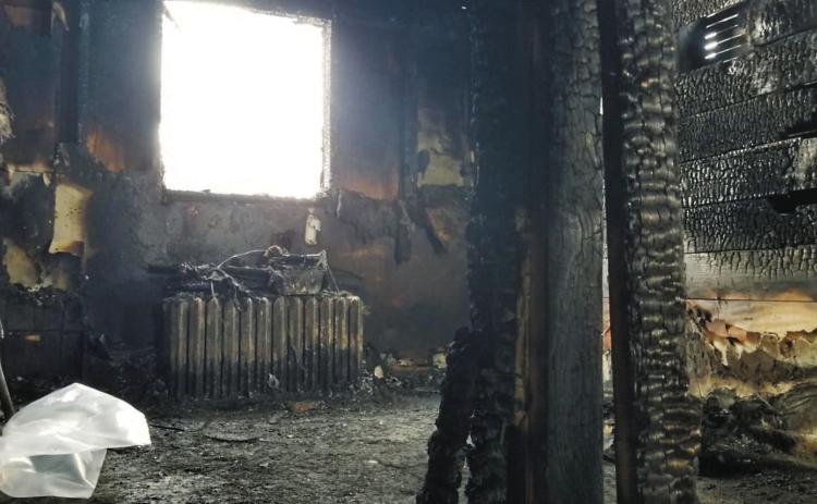 The scorched interior of the apartment building which caught fire Sunday, Feb. 23 and has left one man in critical condition. Photo by DJ Bartley.