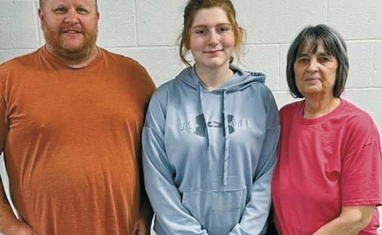 From left to right, Jay Brusseau, committee member; Miranda Waterbury, 2024 scholarship recipient; and Deb Peterson, Mike Peterson’s mother. Submitted photo.