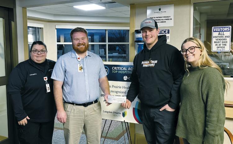 Langdon Ambulance Sharla Haas and Chris Bennett with Pembina Gorge Dirt Riders club members Ben Girodat and Halle Johnsrud.