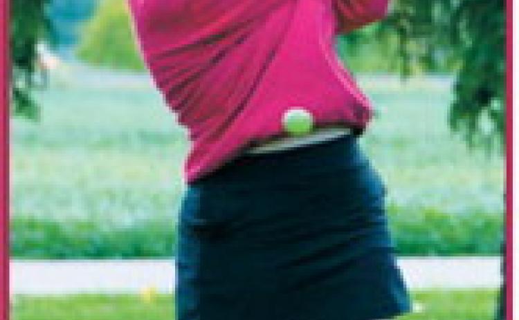 Victoria Matthews eyes the ball as she tees off at the Park River golf meet on Sept. 8. Photo by Larry Stokke