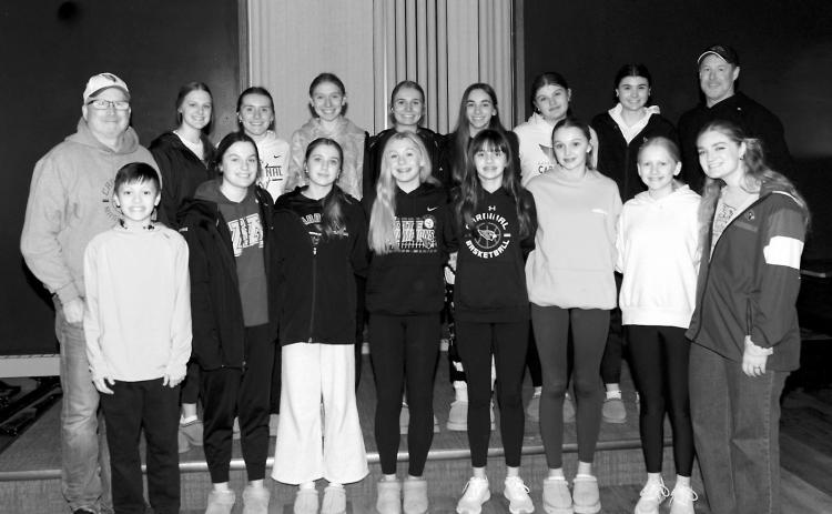 The Eagles Club welcomed the Cardinals Girls Basketball Team for a free meal on March 14 to celebrate their 5th place finish at the state tournament. Back row (L-R) Coach Rob Scherr, Mikaela Olson, Meredith Romfo, Aubrey Badding, Kemi Morstad, Avery Lorenz, Fenja Lawson, Taya Fiest, Coach Andy Haaven; front row, Leo Zimmer, Erika Bakke, Meggy Hetletved, Hilary Haaven, Lily Zimmer, Hallie Overby, Charlotte Haaven, and Coach Morgan Mikkelson. Photo by Larry Stokke.
