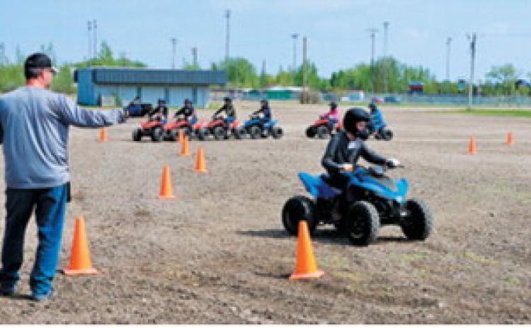 A child participates in a North Dakota OHV Youth Safety Course certification training program held during an NDSU Extension Farm Safety Camp. NDSU photo