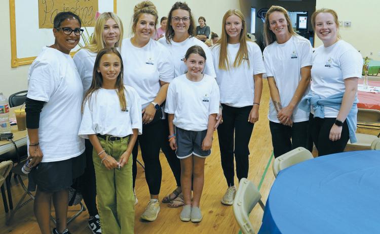 A small portion of the many volunteers at the LPH Foundation Picnic. Back row (L-R) Shanda Christianson, Raelleigh Ratzlaff, McKinzie Sivertson, Kayla Kram, Nora Lorenz, Hilary Nowatzki, Hope Thorlakson; front row, RayeLynn Christianson, and Kamden Kram. Photo by Larry Stokke.