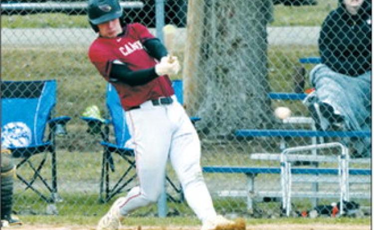 Jax Johnson connects for a base hit in the Cardinals’ game against the Grizzlies. Photo by Larry Stokke