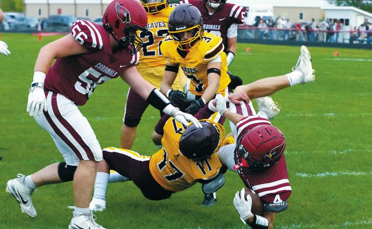 Sam Davis eludes a tackle and gets over the goal line to tack on six points. Photo by Larry Stokke.
