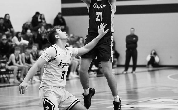 Brody Berg sinks a three-pointer. Photo by Ashley Schafer.