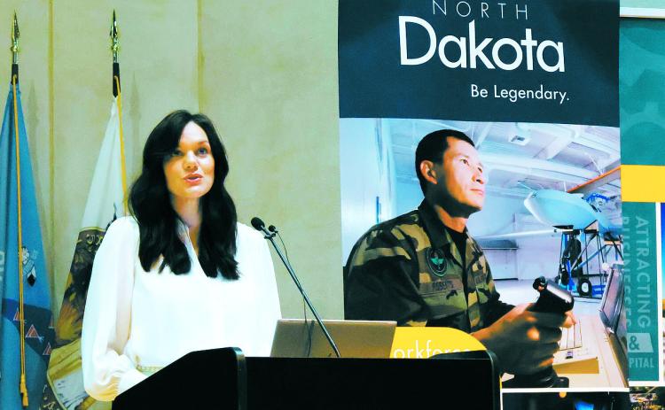 Katie Rolston Howe, director of workforce development for the North Dakota Department of Commerce, delivers remarks Aug. 21, 2024, during a Global Talent Summit at the Heritage Center that focused on workforce issues. (Michael Achterling/North Dakota Monitor)