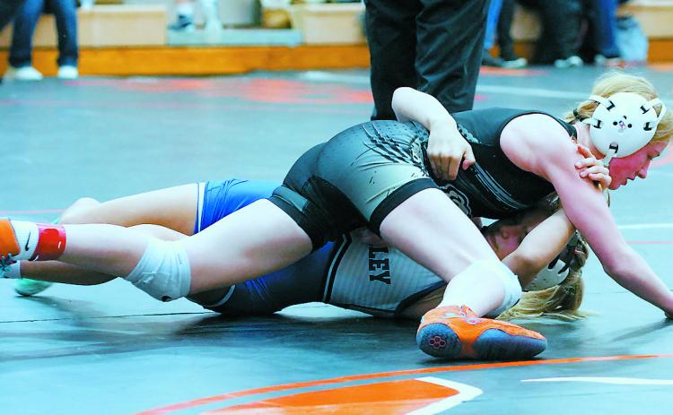 Charlotte Crowston pinned her opponent on her way to a runner-up finish in her weight class in Rugby Jan. 25. Photo by Larry Stokke.