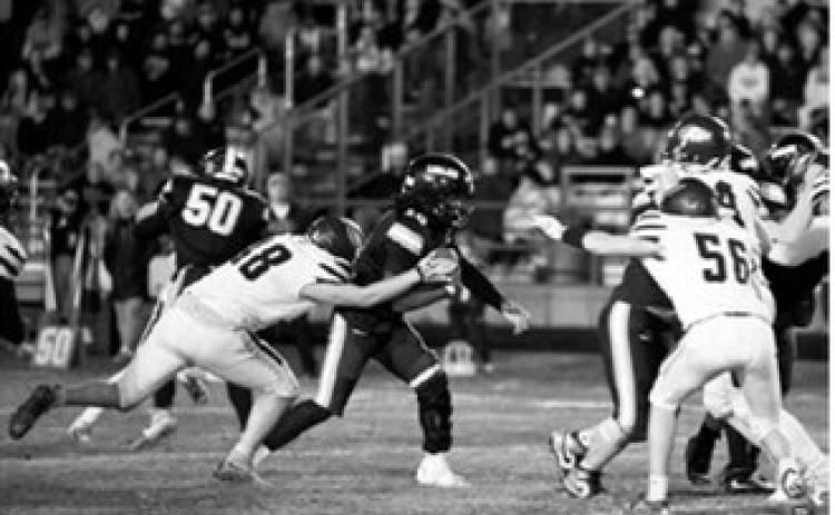 Chase Mench (48) wraps up a Cavalier ball carrier during the Eagles' game Friday, Oct. 16, in Cavalier. Photo by Ashley Ashley Schafer