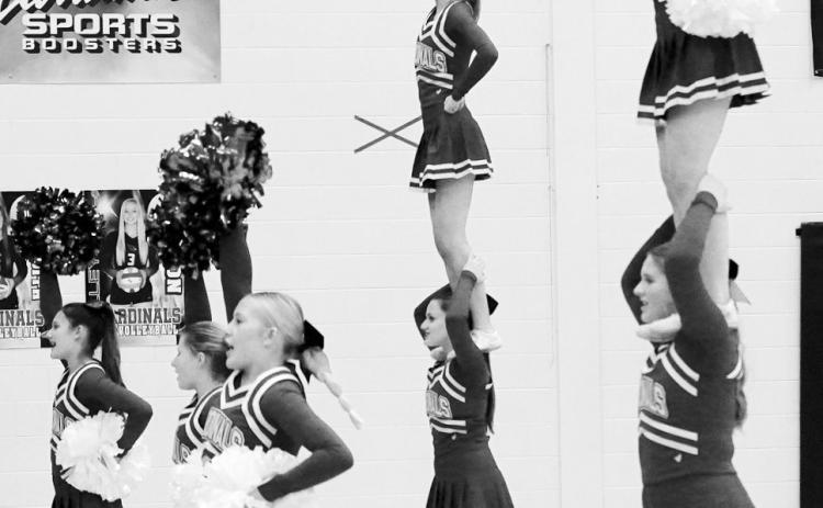 The Cardinal cheerleaders kept the crowd fired up in the first home game against Nelson County. Photo by Larry Stokke.