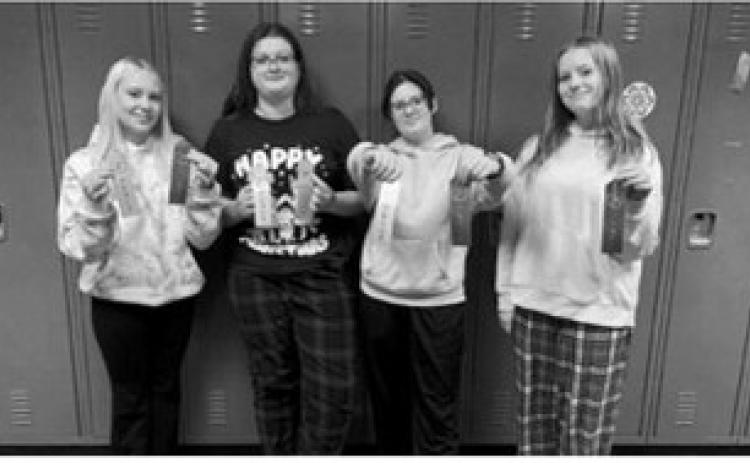 Four Langdon students competed at the meet. From left: Jaymee Reidhammer placed fourth in poetry and second place in serious prose; Matilda Lawson placed fourth in storytelling and third in impromptu; Kaydence Lundquist placed seventh in poetry and third in storytelling; and Sophie Mryvik placed second in storytelling.