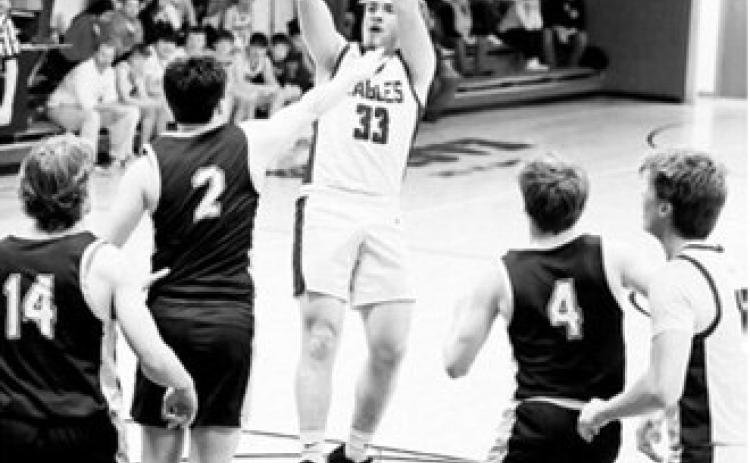 #33 Kade Schafer puts up a jumper for two of his 13 points on the night. Photo by Ashley Schafer