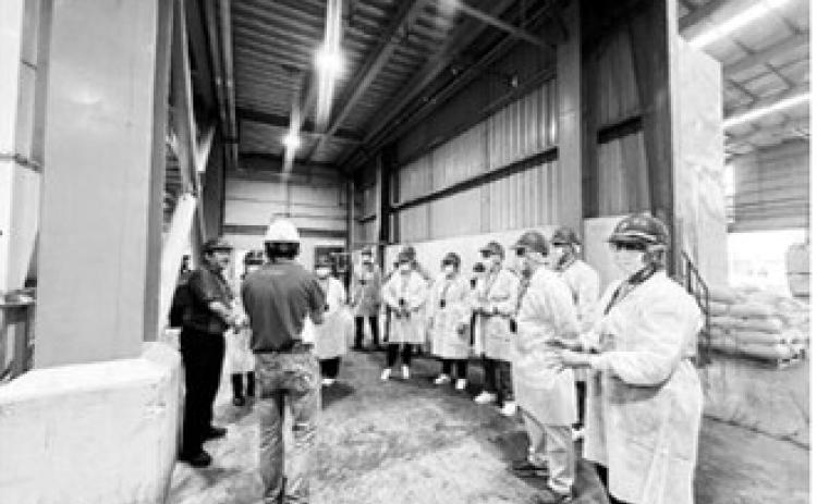 The North Dakota delegation made numerous stops, including a visit to a feed mill. ND Soybean Council photo