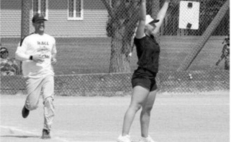 McKenna Schneider makes the catch at first base to record an out against Zack Schaefer during the co-ed softball tournament. Photo by Larry Stokke