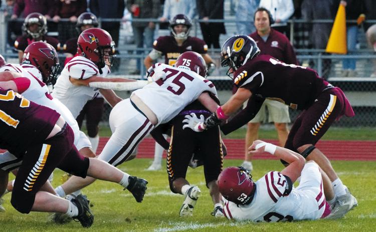 Keaton Ullyott tackles a Spoiler ball carrier for a turnover in downs. Photo by Larry Stokke.