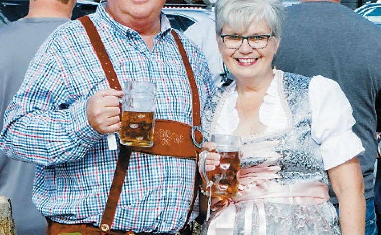 Mark and Kyza Zimmer pose together for a photo at last year’s Oktoberfest in Munich. Fundraising for the community event is underway with a meat raffle on Monday, June 30 at the Munich City Plaza. Photo by Larry Stokke.