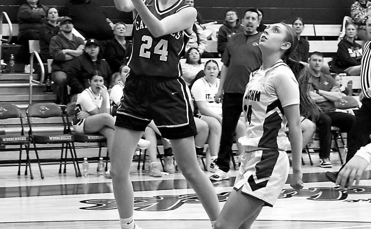 Avery Lorenz was Player of the Game in the Lady Cards' win over the ST John Woodchucks with an 18-point game. Photo by Larry Stokke.