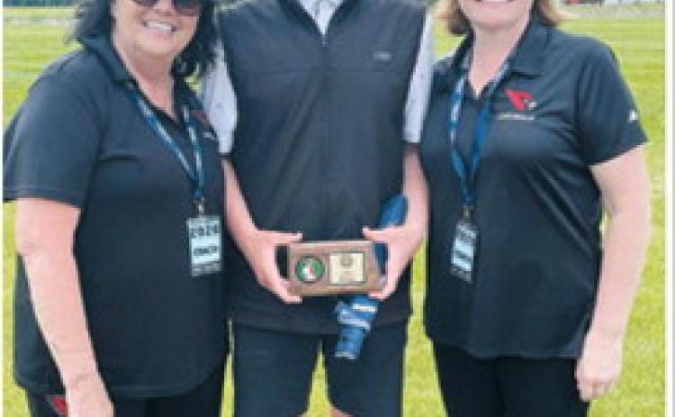 Ryder Moser, center, poses with Langdon Area/Munich golf coaches Connie Kjos, left, and Jenny Romfo after earning All-State honors at the North Dakota State Golf Tournament. Moser capped off an outstanding season with the prestigious statewide recognition. Photo submitted