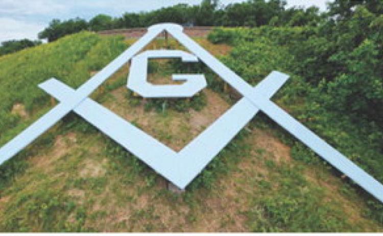 Walhalla’s Masonic square-and-compasses emblem remains a prominent hillside landmark more than 75 years after it was built in 1951. Recent work has helped preserve the structure and keep the longtime symbol visible for future generations. Photo courtesy of Duane Symons