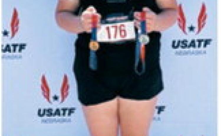 Fenja Lawson of Langdon displays the medals she earned at the 2026 USATF Region 8 Junior Olympics in Gretna, Neb. Lawson placed second in the discus with a throw of 40.19 meters to qualify for the 2026 USATF National Junior Olympic Track &amp; Field Championships in Norwalk, Calif. She also finished sixth in the shot put while competing for the Dinius Track and Field Club. Submitted photo