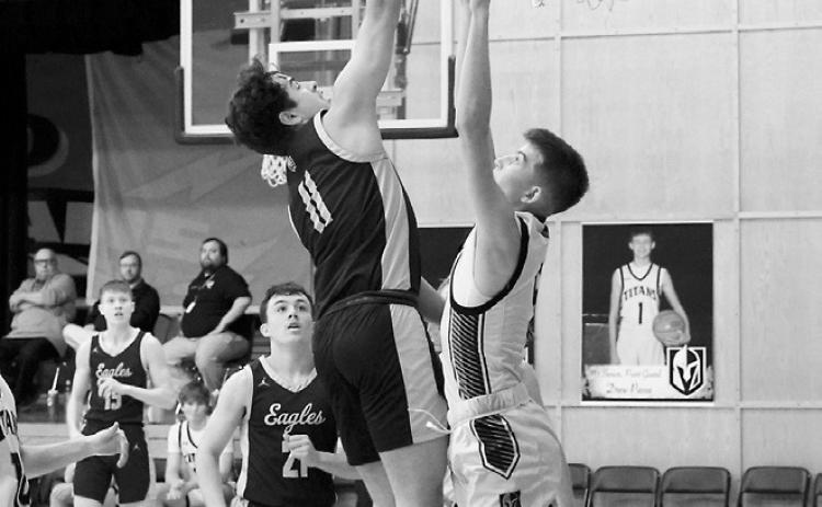 Grant Cosley adds 2 points to his 17-point night in Drayton in the Eagles win over the Titans. Photo by Larry Stokke.