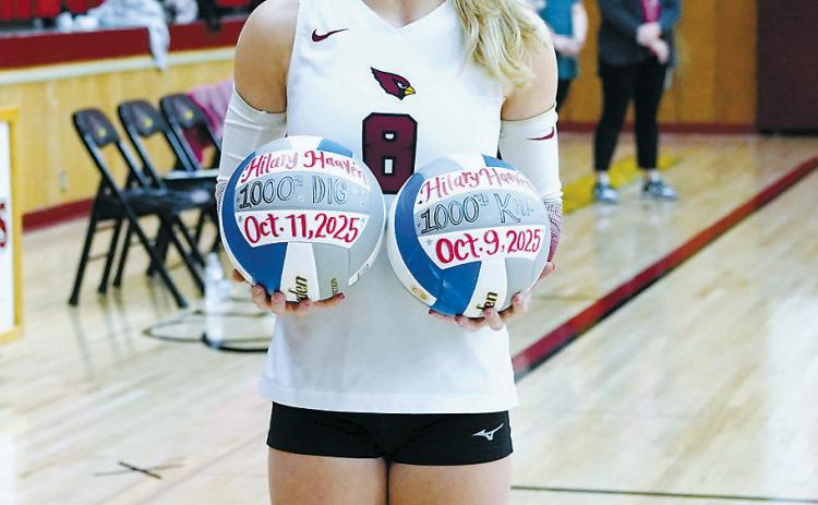 Lady Cards freshman Hilary Haaven did something that's been reported as unprecedented in North Dakota volleyball - she reached 1,000 career kills and 1,000 career digs as a freshman. She was presented with two game balls for this accomplishment on Oct. 14. Read more about Haaven and the Cardinals girls volleyball team on Pg. B2. Photo by Larry Stokke.