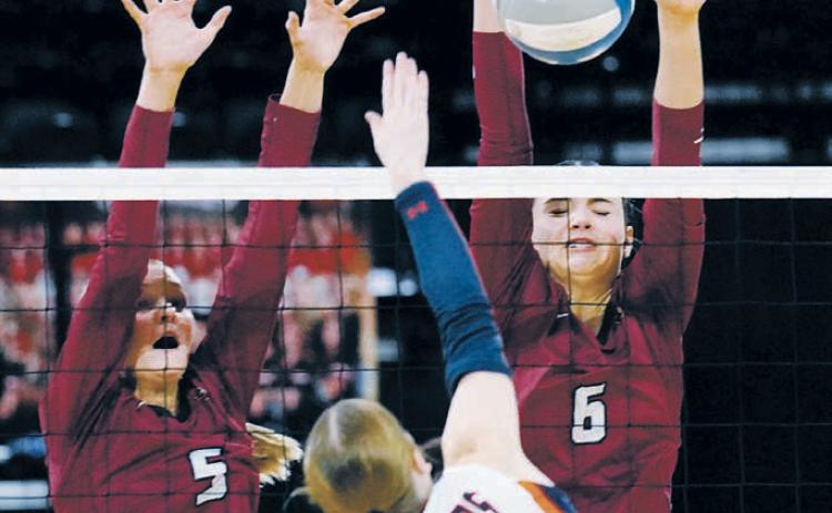 Hallie Overby and Taya Feist team-up to stuff block a Cougar player. Photo by Larry Stokke