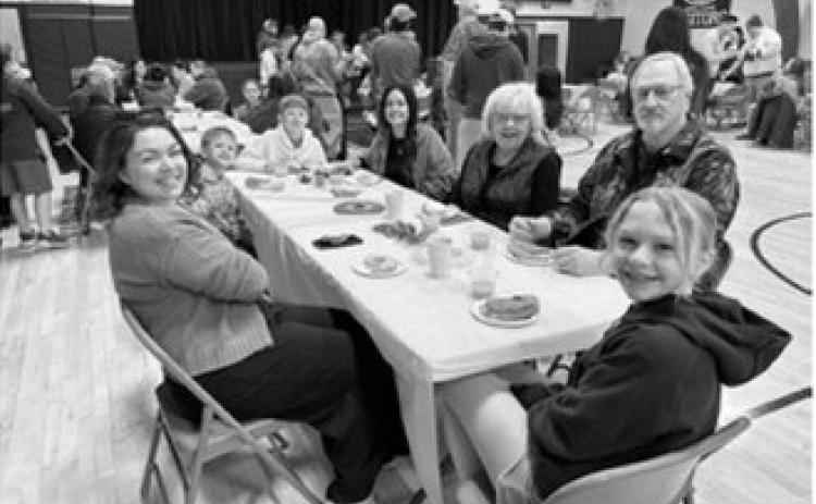 Community in Action hosts Donuts With Grownups at Pembina School