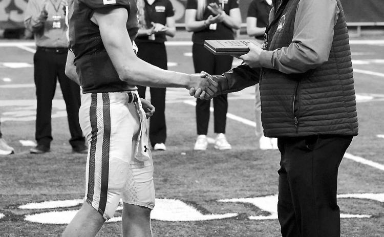 Jax Johnson accepting his Senior Athlete of the Year award. Photo by Larry Stokke.