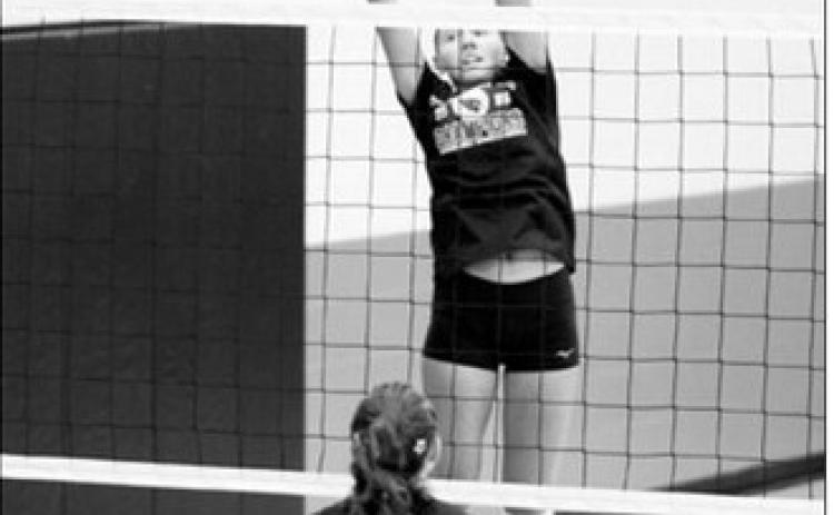 Langdon Area-Munich’s Aubrey Badding sends the ball over the net with a two-handed tip against Park River during a scrimmage Saturday, Aug. 22, in Thompson. Photo by Larry Stokke