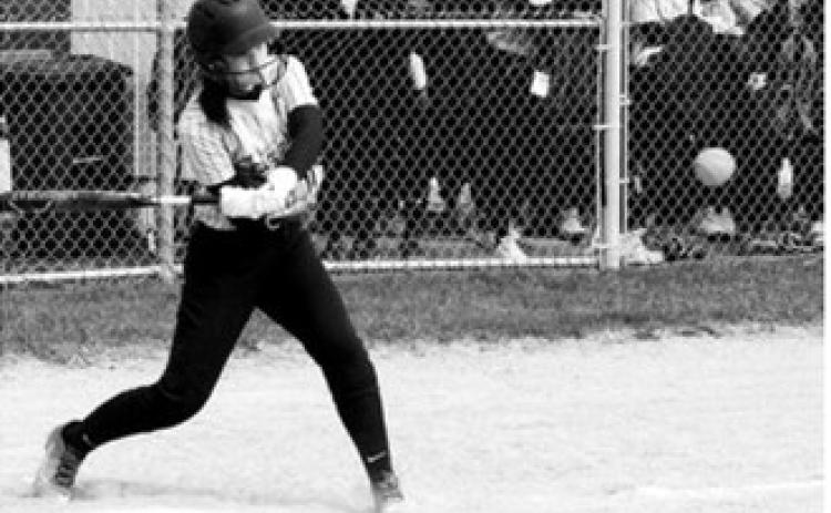 Averie Sondeland keeps her eye on the ball before connecting on a hit to the outfield. Photo by Larry Stokke