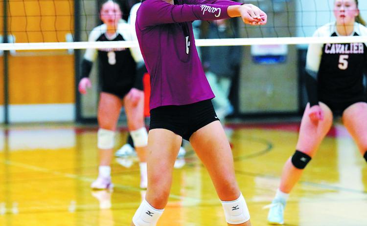 Taya Feist passes the ball to a teammate in the Cards' win over Cavalier. Photo by Larry Stokke.