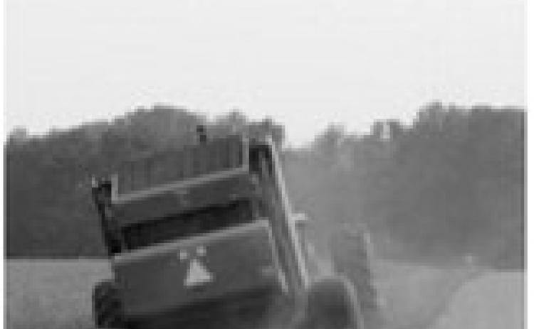 Following safe practices while mowing or haying roadway ditches can help prevent equipment damage and serious injuries. NDSU photo.