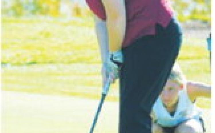 Stella Busse sinks a putt during the Class B Girls Golf State Tournament Sept. 29-30 in Carrington. Photo by Larry Stokke