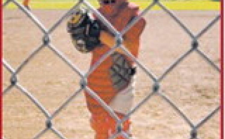Griffey Bata gets set behind the plate while catching during an 8U baseball game in Cavalier. Submitted photo
