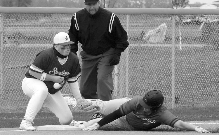 Theo Romfo gets on base against Grafton on May 19. Photo by Larry Stokke.