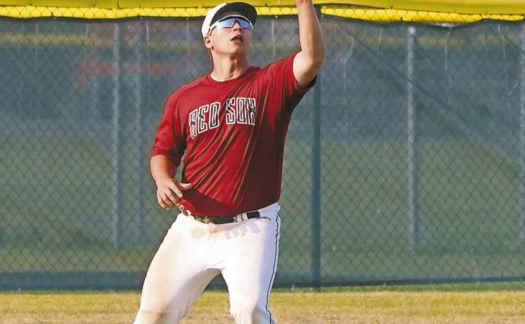 Cole Welsh gloves a deep hit ball in center field and went 3 for 3 batting and had three RBI’s against Park River. Photo by Larry Stokke.