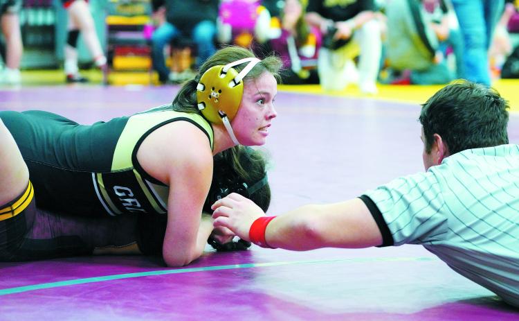 Ava Kemnitz stares ahead with great concentration as she gets the win in Belcourt on Dec. 7. Photo by Larry Stokke.