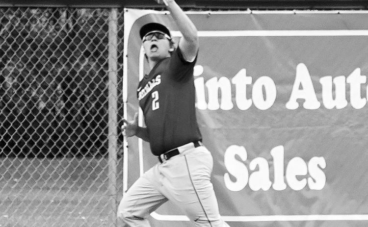 Cole Welsh makes a catch at the fence in center field for a 3rd out against Grafton on May 20 in Minto. Photo by Larry Stokke.