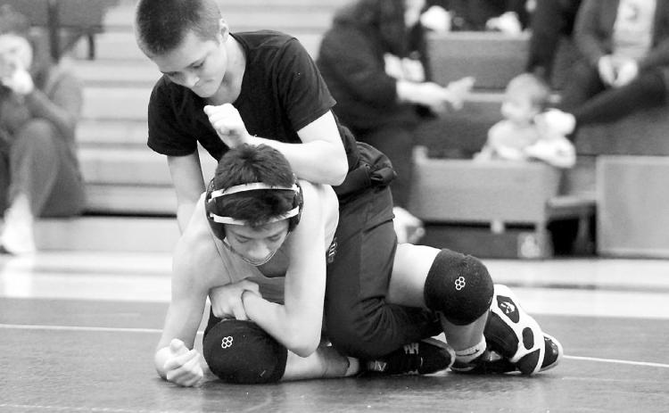 Johnny Robinson wrestled in the preseason scrimmage in Grand Forks on Nov. 15 in the 114-pound weight class. Photo by Larry Stokke.