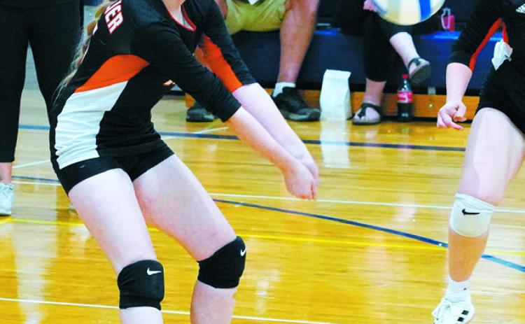 Maelle Robinson digs the ball in the Tornadoes game against the Eagles. Photo by Larry Stokke.