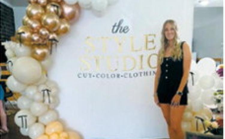 Boutique owner Jennifer Hendrickson poses during the grand opening of The Style Studio in Langdon. Hendrickson recently launched the clothing and accessories boutique inside Glitz &amp; Glam Beauty Bar, combining her passions for hairstyling and fashion. Submitted photo