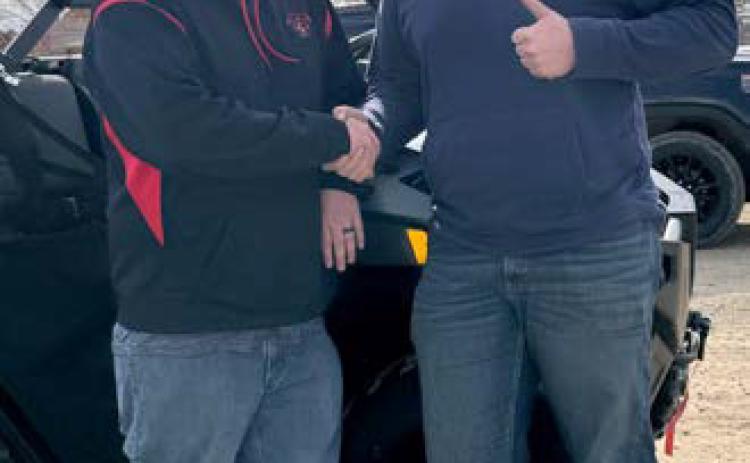 The grand prize winner was Hayes Haslekaas being congratulated here by Wales Fire Department member Brandon Domres. Submitted Photo.