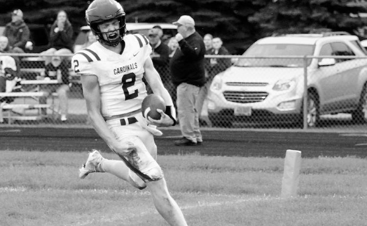 Jax Johnson crosses the goal line for a touchdown, finishing the game with 111 yards rushing and two touchdowns. Photo by Larry Stokke.