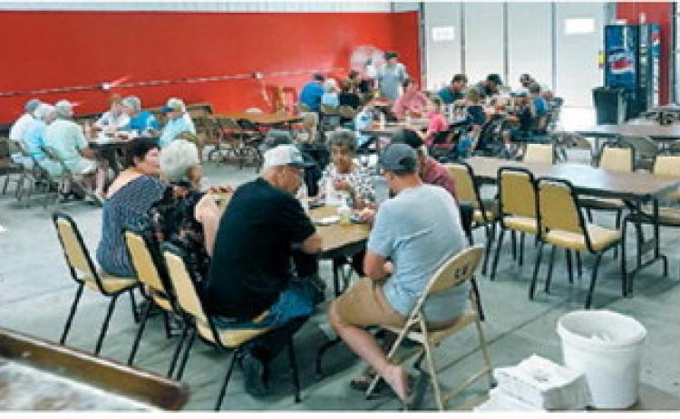 Community members gather for a meal during the Nekoma Rural Fire Department fundraiser. The annual event brings residents together while raising funds to support the department's equipment, training and emergency response efforts. Submitted photo