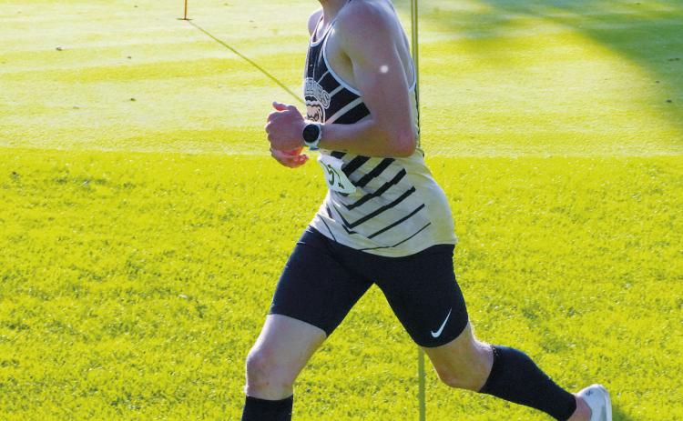 Nash Fitzsimonds set a fast place early and finished first in the meet with a time of 18:16.69. Photo by Larry Stokke.