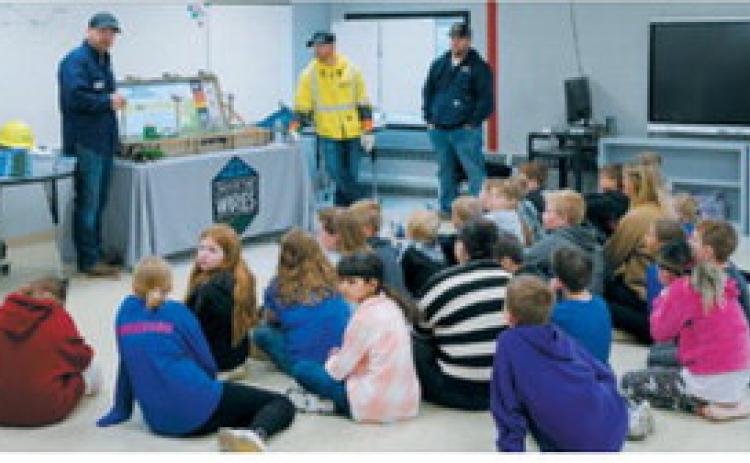 Students learn about power line safety during Elementary School Safety Day on May 18. The presentation taught students how to recognize electrical hazards and stay safe around power lines and utility equipment. Photo by Larry Stokke